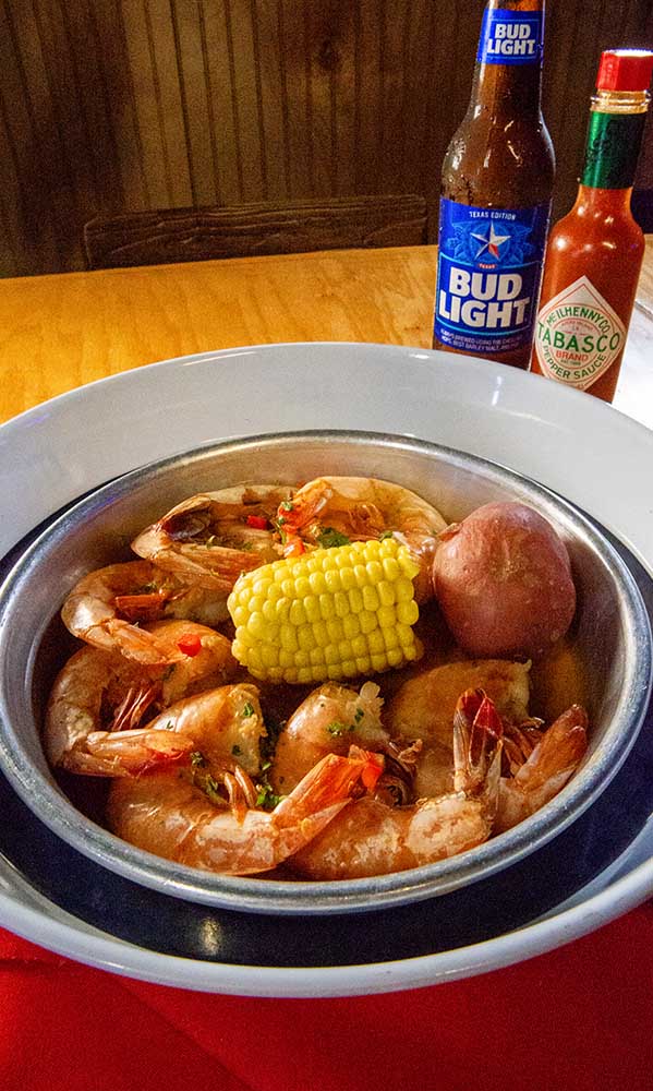 Head-on shrimp caught locally from Galveston and cooked in a sauce.