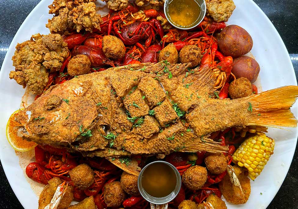 Fresh Seafood Platter 01 Cajun Seafood dish made with boiled crawfish, fried fish, and fried oysters - Galveston TX.