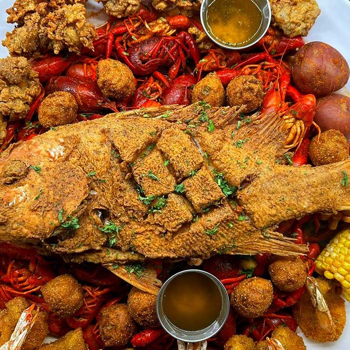 Fresh Seafood Platter 03 Cajun Seafood dish made with boiled crawfish, fried fish, and fried oysters - Galveston TX.